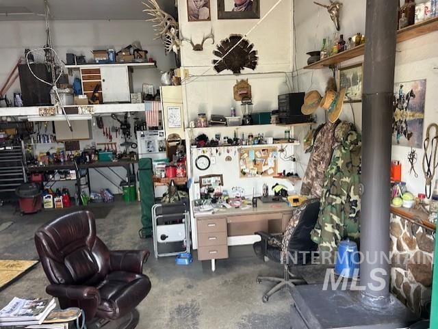 1621 Doumecq Rd, Cottonwood, ID 83522 - home office with a workshop area and unfinished concrete flooring