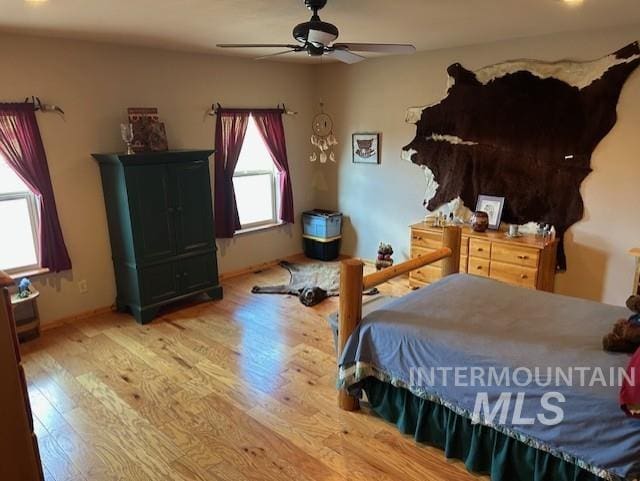 1621 Doumecq Rd, Cottonwood, ID 83522 - bedroom with wood finished floors, a ceiling fan, and baseboards
