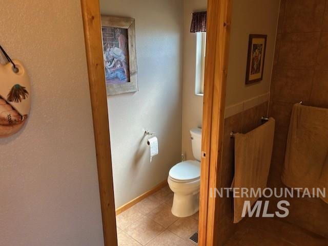 1621 Doumecq Rd, Cottonwood, ID 83522 - bathroom featuring toilet, tile patterned floors, and baseboards