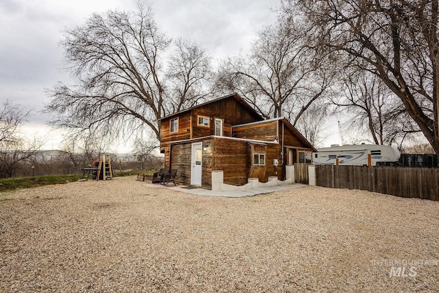 back of property with fence