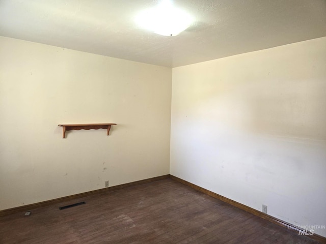 495 1st St E, Huntington, OR 97907 - spare room featuring wood finished floors and baseboards