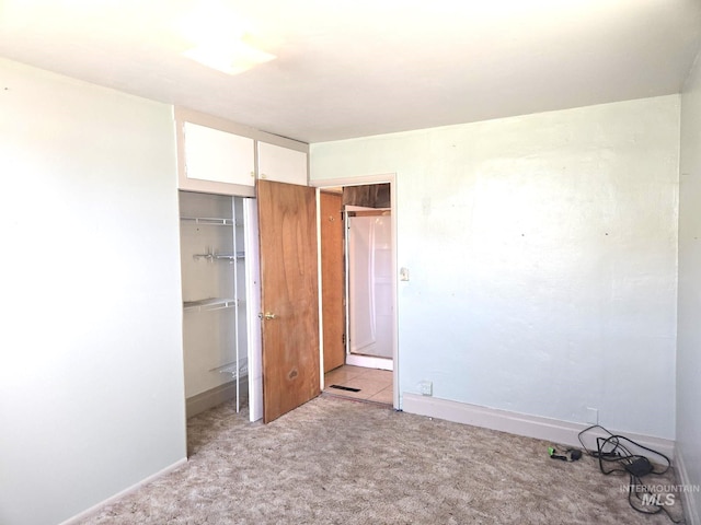 495 1st St E, Huntington, OR 97907 - unfurnished bedroom featuring a closet, light carpet, and baseboards