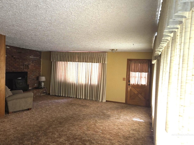 495 1st St E, Huntington, OR 97907 - unfurnished living room featuring a textured ceiling and carpet
