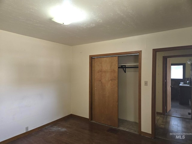 495 1st St E, Huntington, OR 97907 - unfurnished bedroom featuring a closet and baseboards