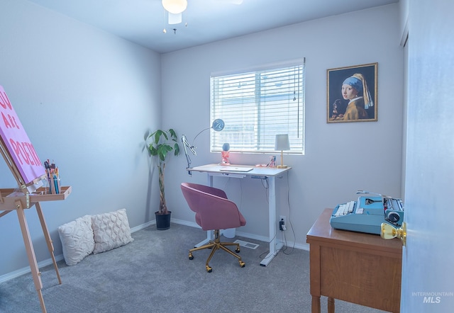 carpeted home office with baseboards