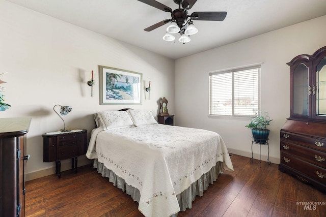 bedroom featuring dark wood-style floors, ceiling fan, and baseboards