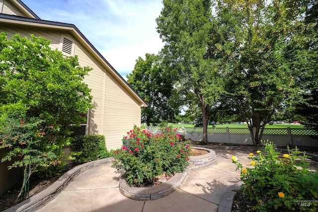 view of patio featuring fence