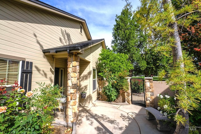 view of patio / terrace with a gate and fence