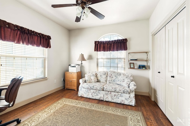 office with a ceiling fan, baseboards, and wood finished floors