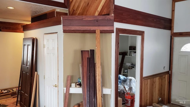 interior space featuring a wainscoted wall and wood walls