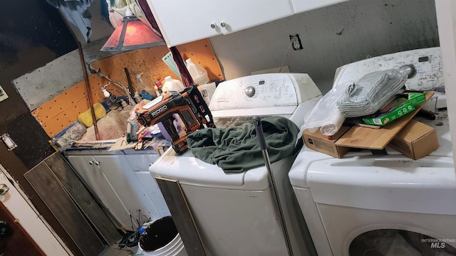 washroom featuring laundry area and separate washer and dryer