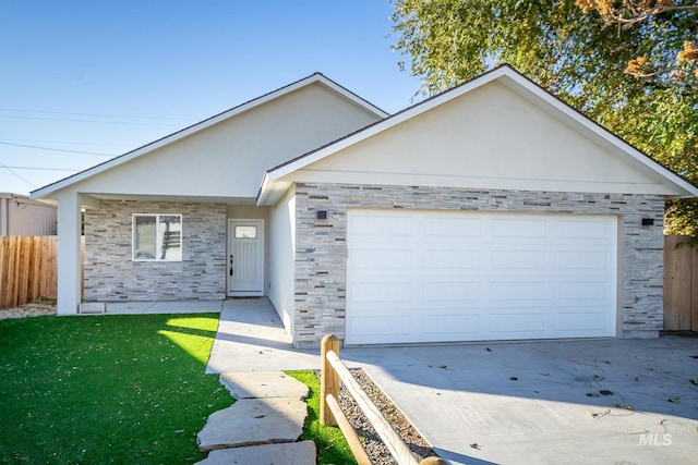 ranch-style house with a garage and a front lawn