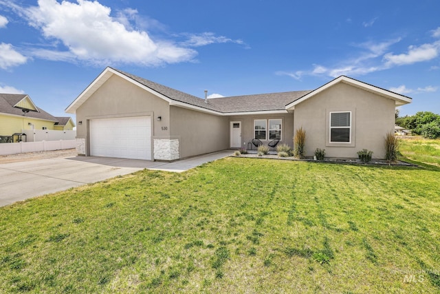 ranch-style house with an attached garage, stucco siding, and driveway