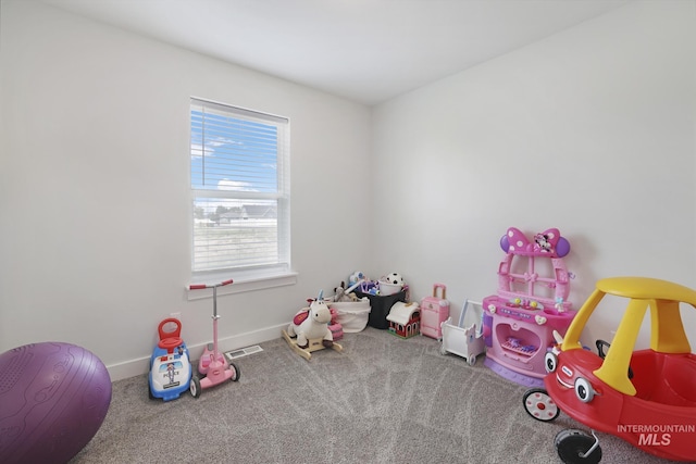 rec room featuring carpet and baseboards