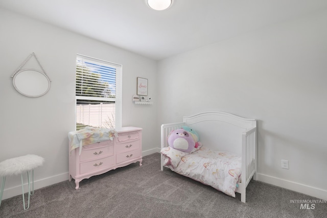 carpeted bedroom with baseboards
