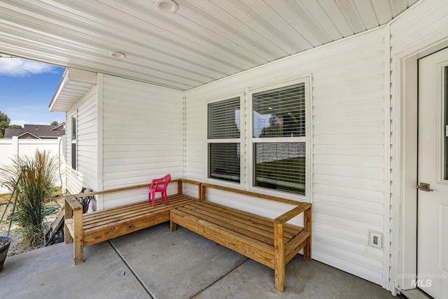 view of patio featuring fence