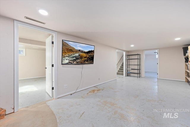 unfurnished room featuring baseboards, visible vents, stairs, concrete flooring, and recessed lighting