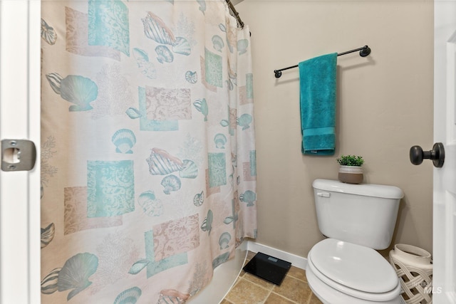 bathroom featuring baseboards, toilet, and a shower with shower curtain