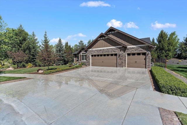 craftsman inspired home featuring board and batten siding, stone siding, a garage, and driveway