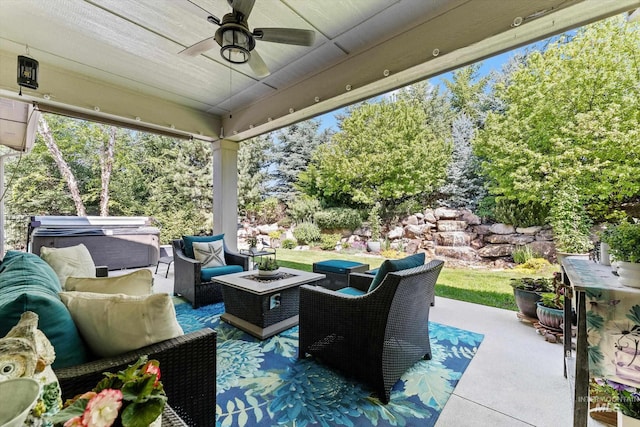 view of patio / terrace with outdoor lounge area, ceiling fan, and view of scattered trees