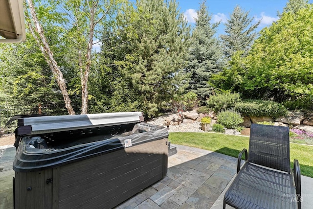 view of patio / terrace featuring a hot tub