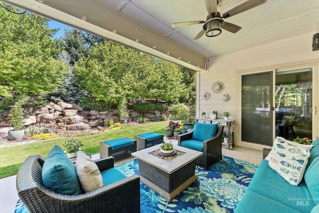 view of patio / terrace with an outdoor living space and ceiling fan