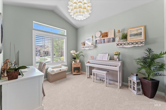 living area featuring carpet floors, lofted ceiling, a desk, and baseboards