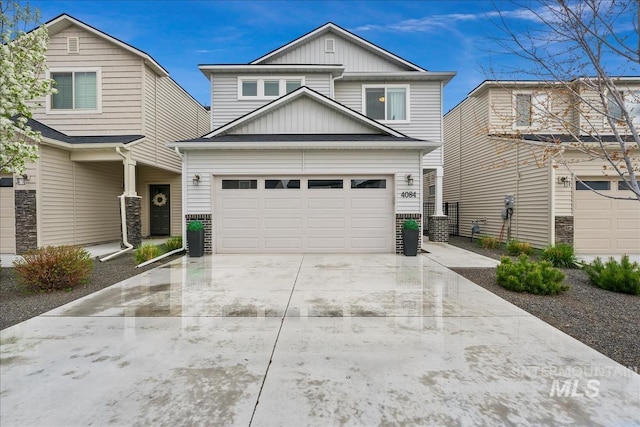 4084 E Esperanto St, Meridian, ID 83642 - view of front of house with concrete driveway, board and batten siding, and a garage
