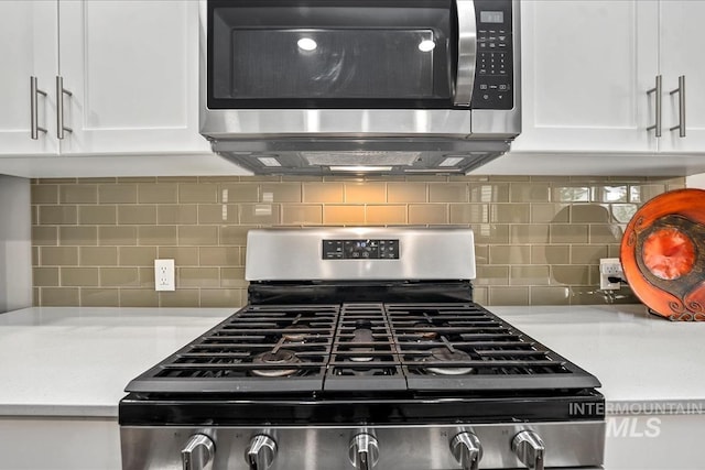 4084 E Esperanto St, Meridian, ID 83642 - kitchen with light countertops, white cabinets, and stainless steel appliances