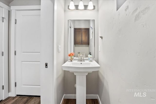 4084 E Esperanto St, Meridian, ID 83642 - bathroom with wood finished floors, a sink, and baseboards