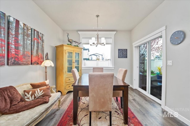 4084 E Esperanto St, Meridian, ID 83642 - dining space with wood finished floors, visible vents, a notable chandelier, and baseboards