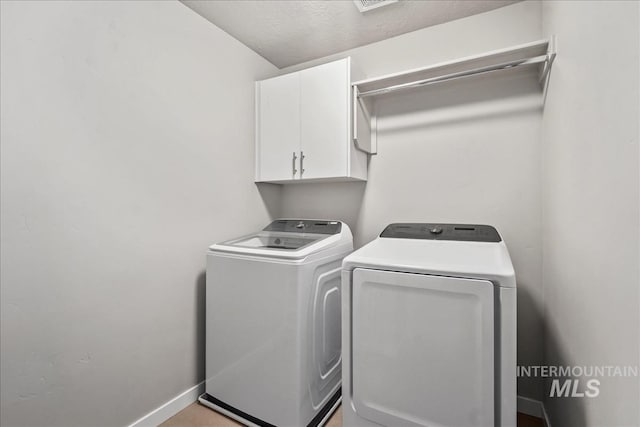 4084 E Esperanto St, Meridian, ID 83642 - clothes washing area with separate washer and dryer, baseboards, and cabinet space