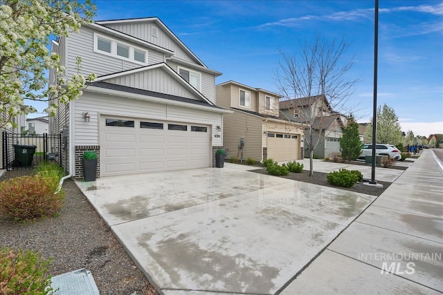 4084 E Esperanto St, Meridian, ID 83642 - exterior space with a garage, driveway, board and batten siding, and fence
