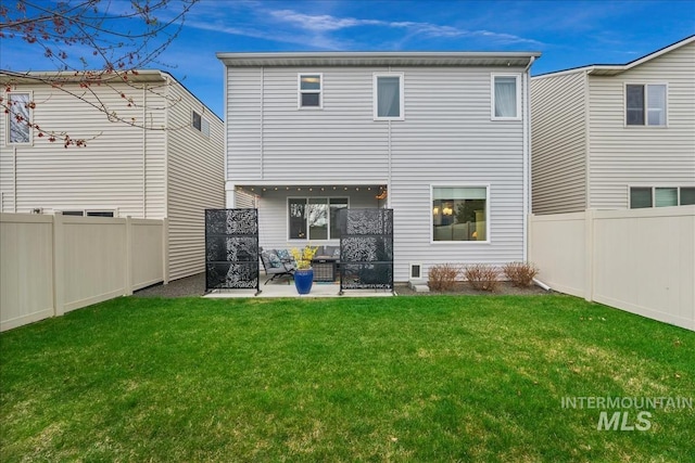4084 E Esperanto St, Meridian, ID 83642 - rear view of property featuring a yard, a patio area, and a fenced backyard