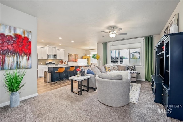 4084 E Esperanto St, Meridian, ID 83642 - living room with light colored carpet, baseboards, a ceiling fan, and recessed lighting