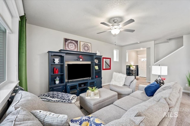 4084 E Esperanto St, Meridian, ID 83642 - living room featuring ceiling fan, baseboards, and carpet