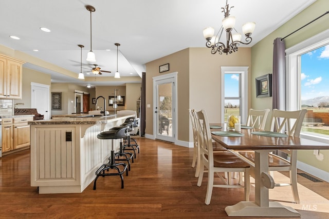 11 W 300 S, Burley, ID 83318 - dining space with ceiling fan with notable chandelier, plenty of natural light, baseboards, and dark wood-type flooring