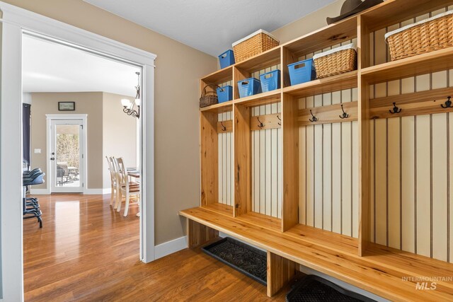 11 W 300 S, Burley, ID 83318 - mudroom with baseboards, wood finished floors, and an inviting chandelier
