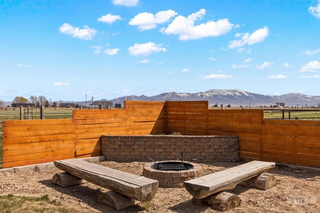 11 W 300 S, Burley, ID 83318 - view of yard with a mountain view, an outdoor fire pit, and fence
