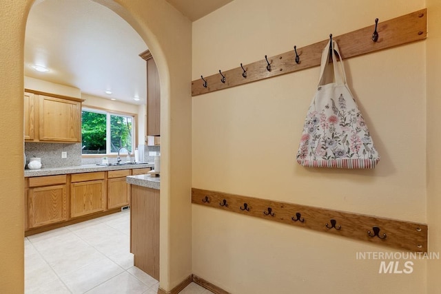 992 N Pinnacle, Eagle, ID 83616 - mudroom featuring arched walkways, a sink, and light tile patterned flooring