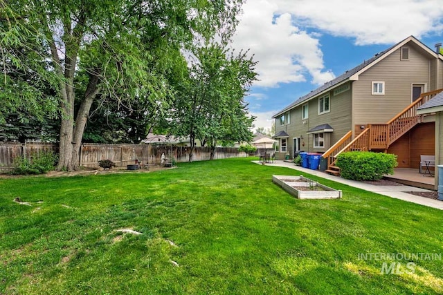 992 N Pinnacle, Eagle, ID 83616 - view of yard with stairs, a garden, a patio, and a wooden deck