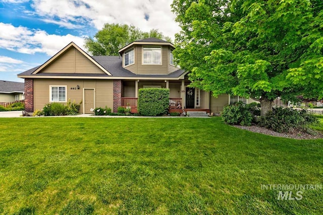 992 N Pinnacle, Eagle, ID 83616 - view of front facade with a front yard, a porch, and brick siding