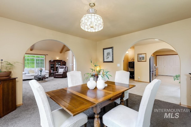 992 N Pinnacle, Eagle, ID 83616 - dining room with arched walkways, light colored carpet, and a chandelier