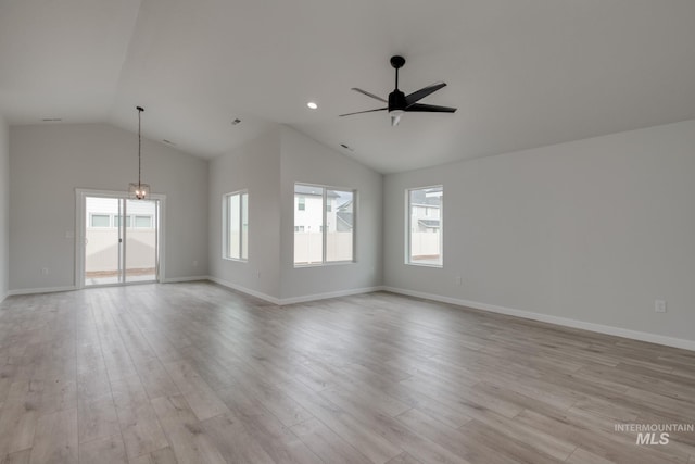 unfurnished living room with lofted ceiling, baseboards, a ceiling fan, and light wood-style flooring