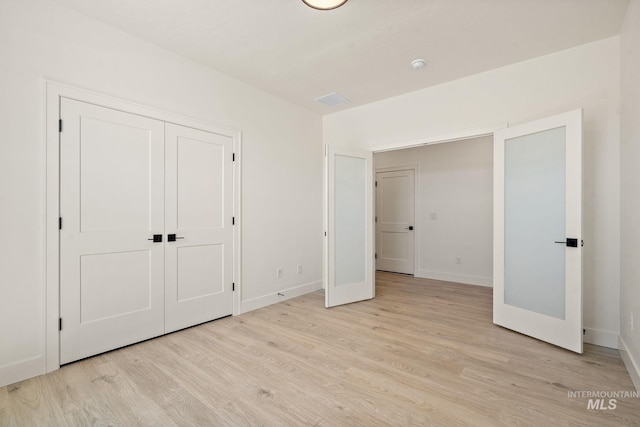 1700 Black Elm, Star, ID 83669 - unfurnished bedroom featuring light wood-style floors and a closet