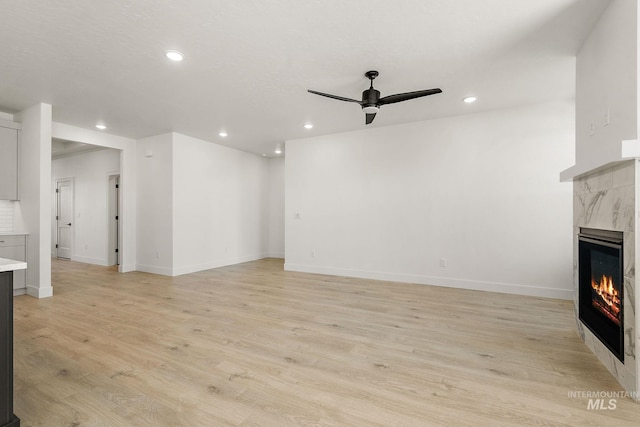 1700 Black Elm, Star, ID 83669 - unfurnished living room with a ceiling fan, a fireplace, recessed lighting, and light wood-style floors