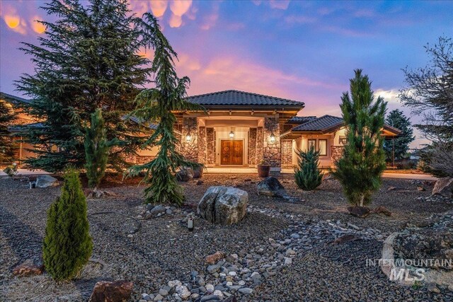 7600 W Ledgerwood Ln, Meridian, ID 83646 - view of front of property with a tile roof and stone siding