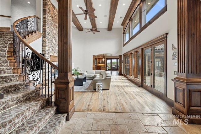 7600 W Ledgerwood Ln, Meridian, ID 83646 - interior space with recessed lighting, beam ceiling, stone tile flooring, a ceiling fan, and a towering ceiling
