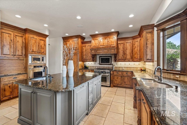 7600 W Ledgerwood Ln, Meridian, ID 83646 - kitchen with a sink, recessed lighting, stone tile floors, and appliances with stainless steel finishes