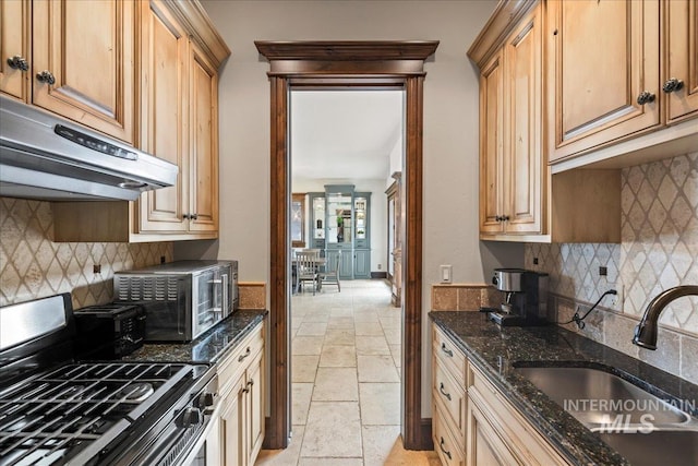 7600 W Ledgerwood Ln, Meridian, ID 83646 - kitchen with tasteful backsplash, stainless steel gas range oven, extractor fan, a sink, and stone tile floors